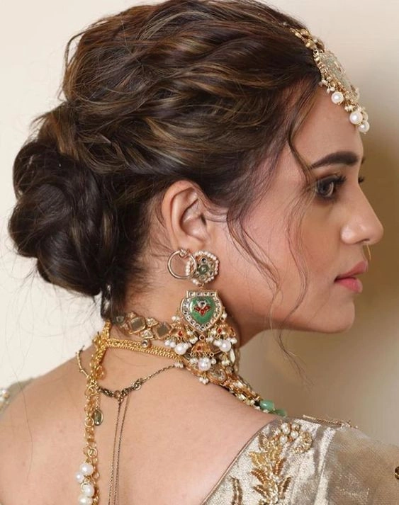 Elegant bridal hair styled to complement a heart shaped face for a wedding day