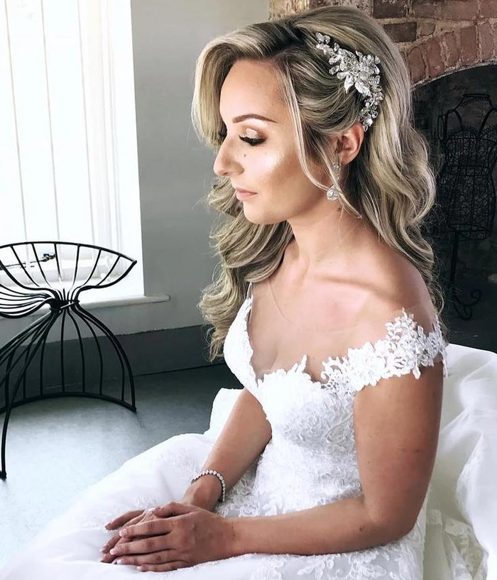 Elegant bridal hair styled to complement an off the shoulder wedding dress