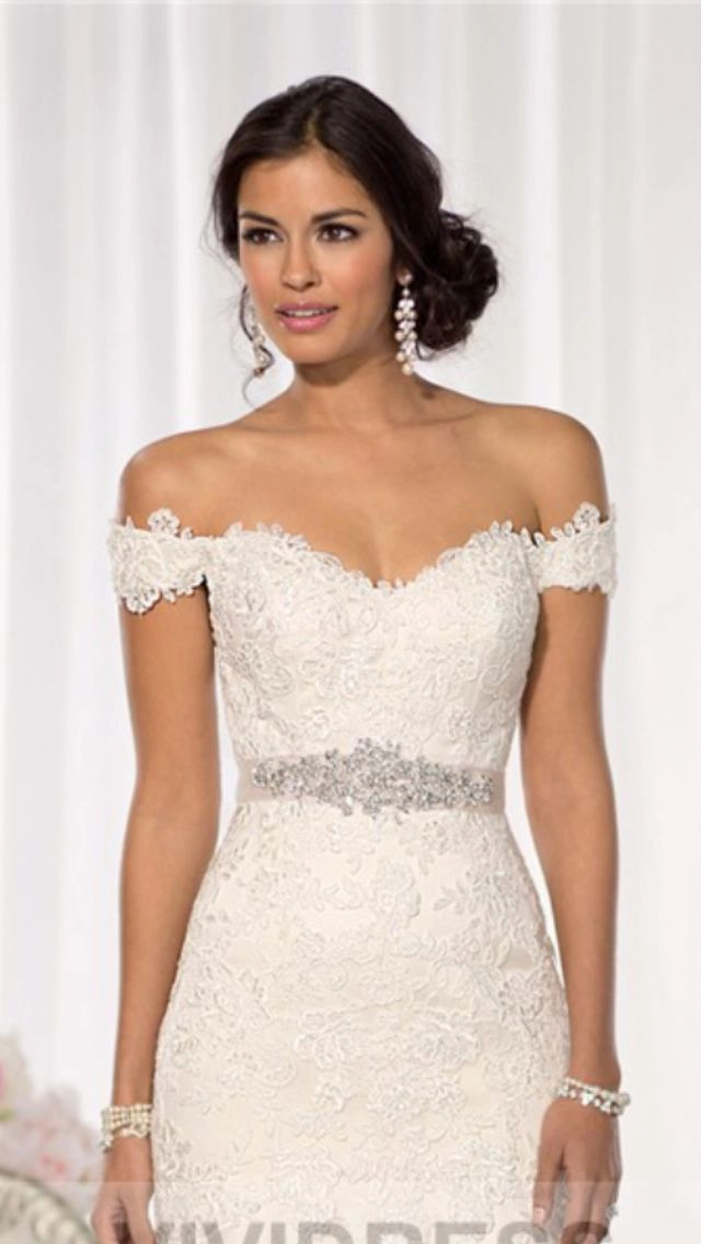 Elegant bridal hair styled for an off the shoulder dress, perfect for a wedding day look