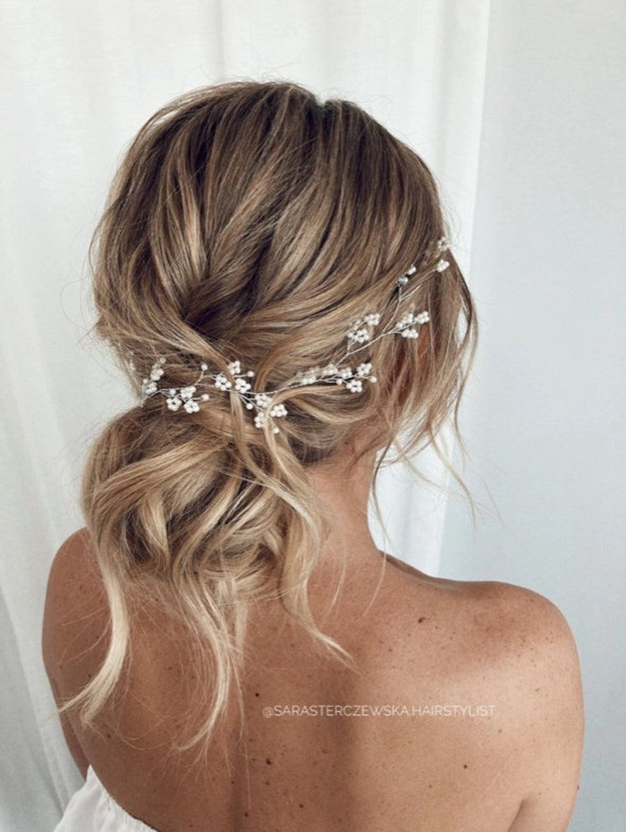 Elegant bridal hair with delicate hairpieces for a wedding day look