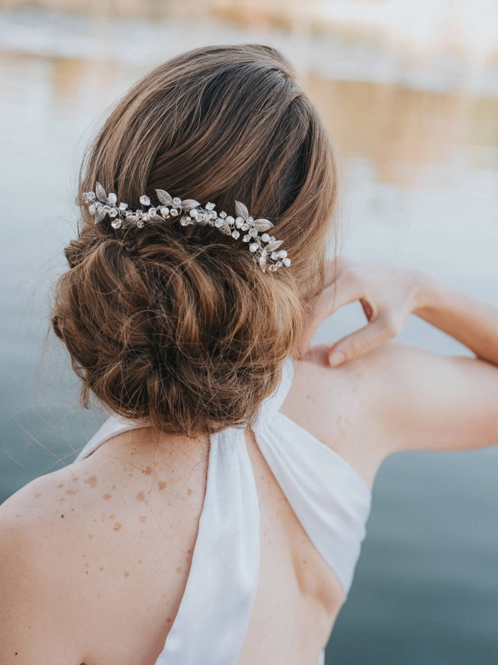 Elegant bridal hair styled with delicate hairpieces for a wedding day