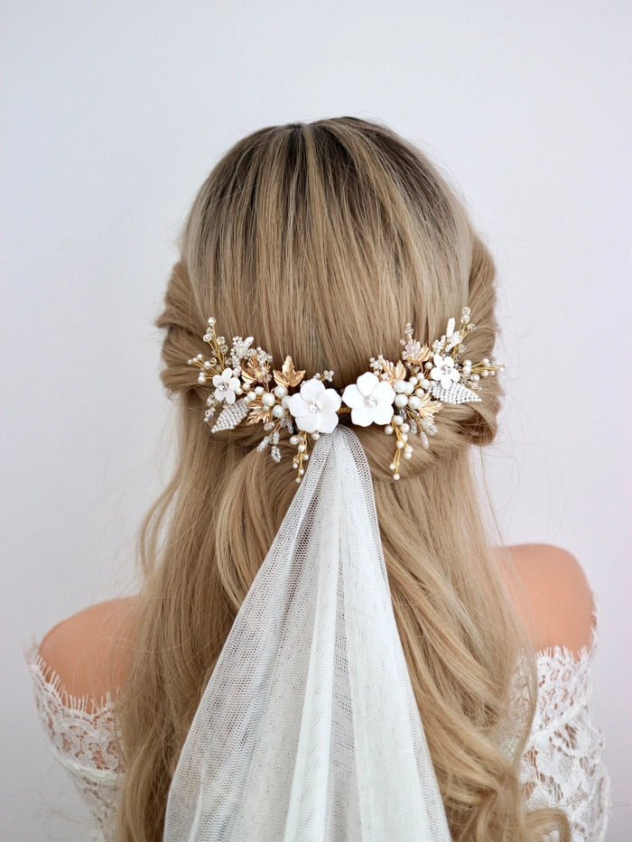 Elegant bridal hair with delicate hairpieces styled for a wedding