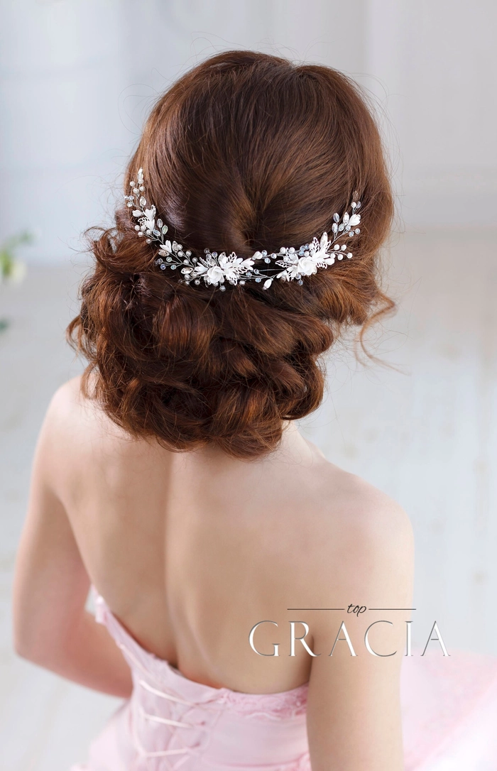 Elegant bridal hair with delicate hairpieces styled for a wedding day