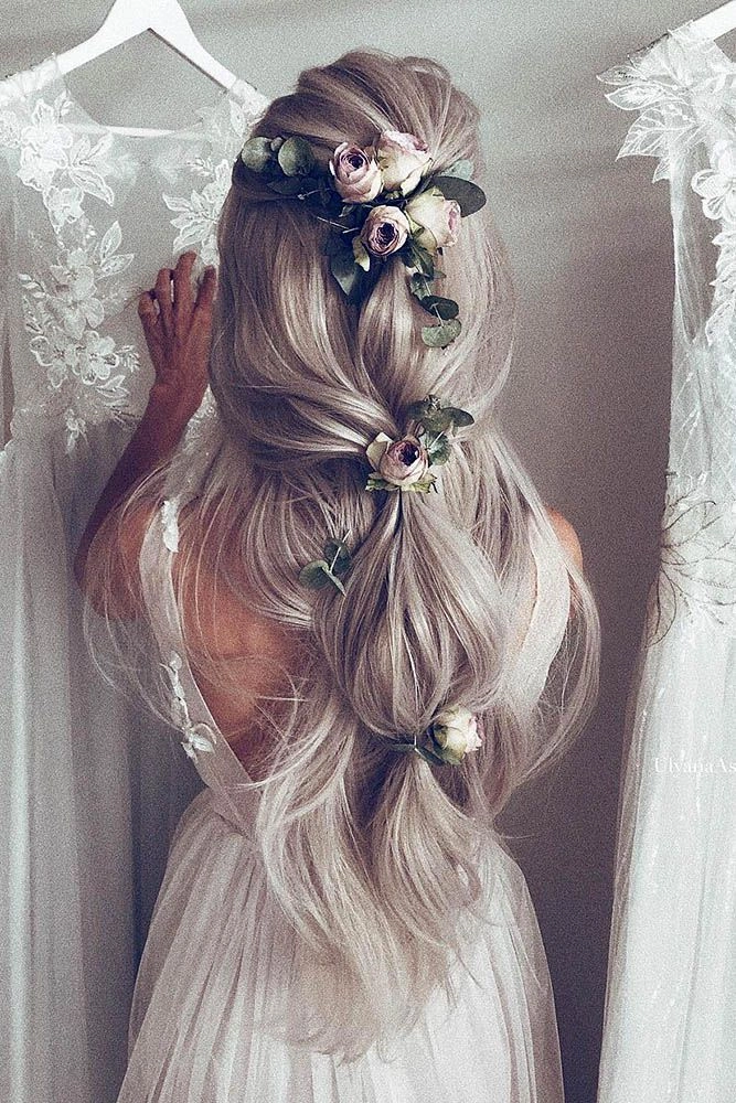Elegant bridal hairstyle with floral accents for an outdoor rustic wedding