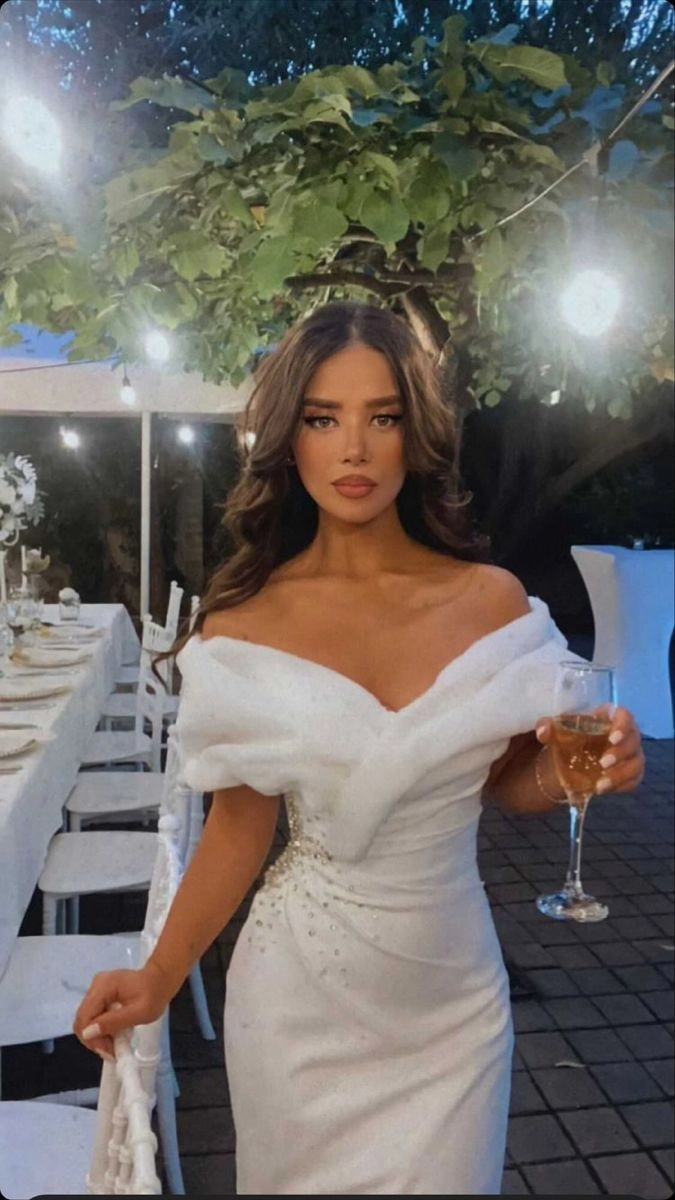 Elegant bridal hairstyle complementing an off the shoulder wedding dress