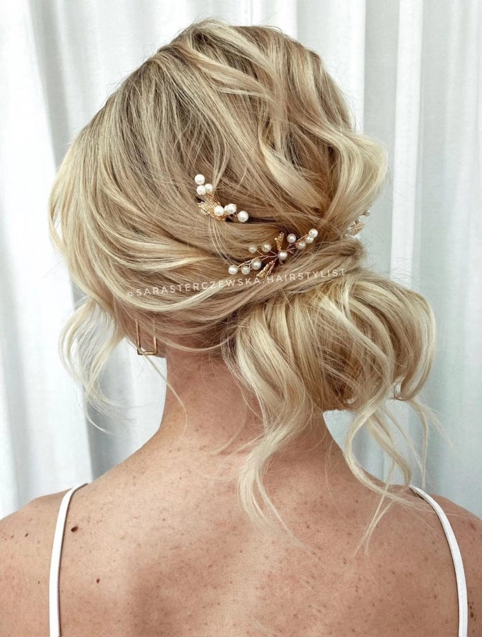 Bridal hair styled beautifully with pearl pins for a timeless wedding elegance Elegant bridal hairstyle adorned with delicate pearl hair pins, perfect for a wedding day look