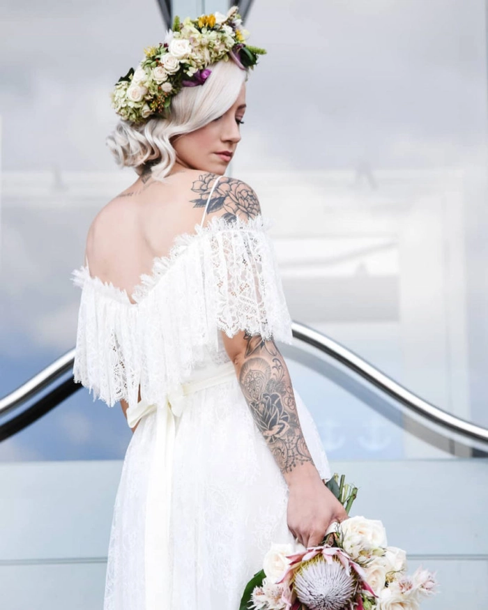 Elegant bridal hairstyle complementing an off the shoulder wedding dress