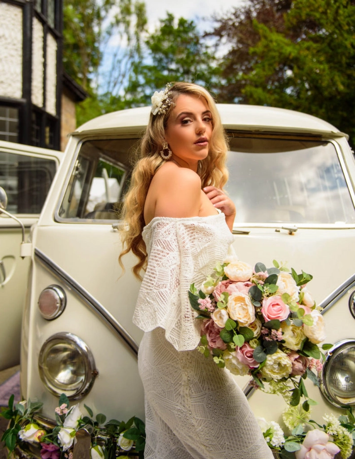 Elegant bridal hair styled for an off the shoulder wedding dress