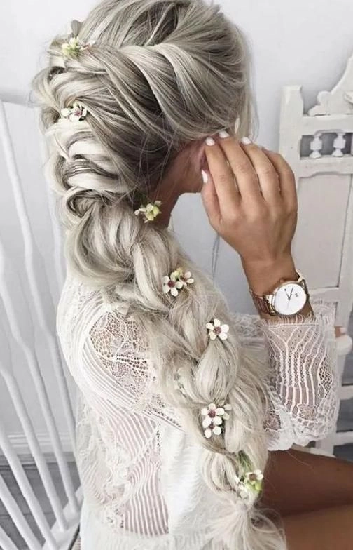 Stunning wedding hairstyle featuring a side braid for brides Elegant bridal hair with side braid styled for a wedding