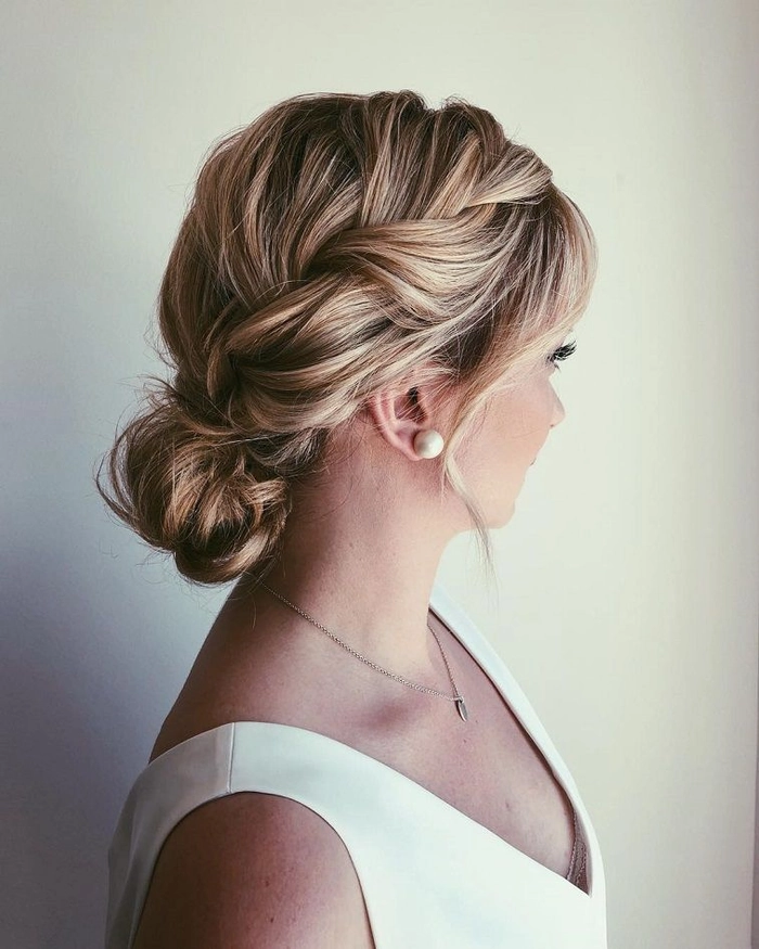 Chic wedding hair knot updo perfect for sophisticated wedding hairstyles Elegant wedding hair knot updo styled with delicate accessories for a bridal look