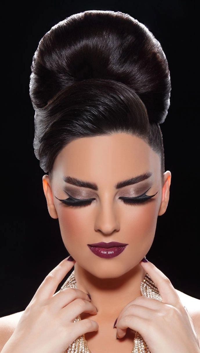 Elegant bride showcasing one of the s big hair wedding styles with voluminous curls