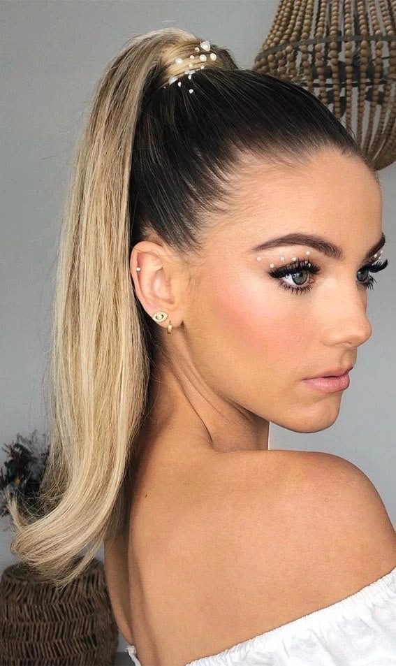 Chic and polished sleek high ponytail perfect for wedding hairstyles collection 12 Elegant bride with sleek high ponytail wedding hair styled for a formal ceremony