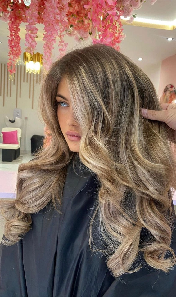 Elegant bride showcasing wedding hair color trends for brides with soft highlights