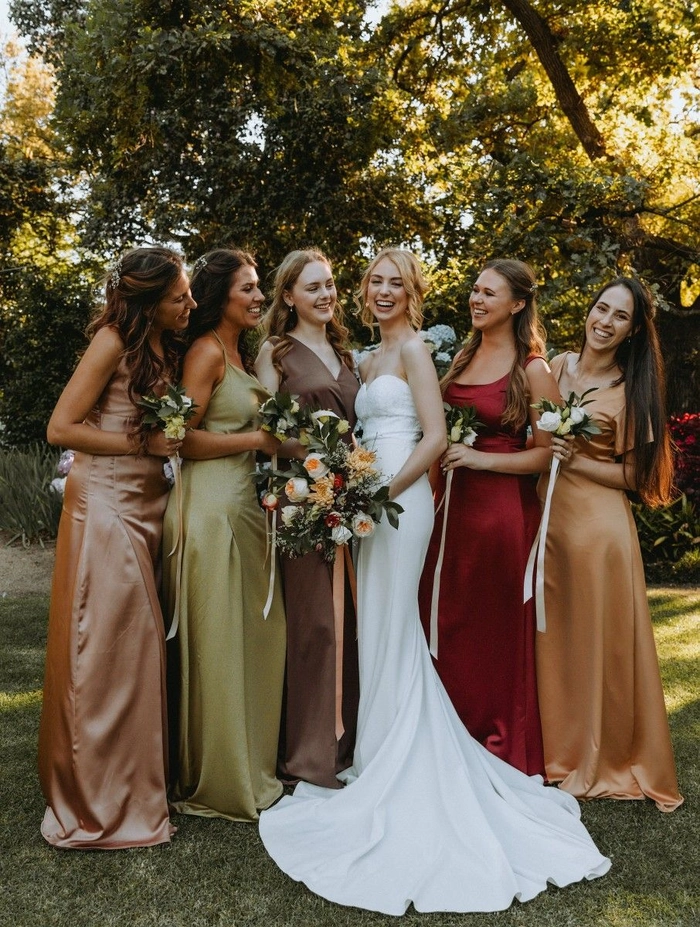 Beautiful bridesmaid hairstyles perfectly coordinated for a wedding party look Elegant matching bridesmaid hairstyles featuring soft curls and floral accessories