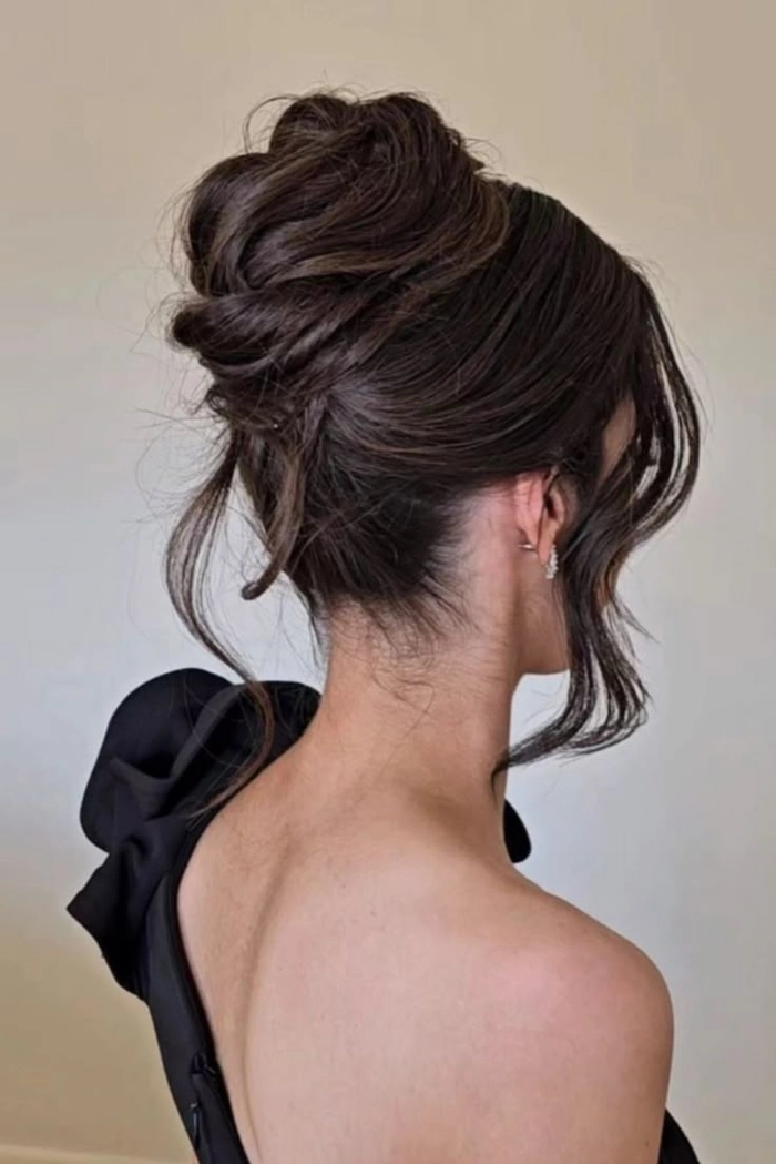 Elegant bridesmaid hairstyles for long hair featuring soft curls and floral accents