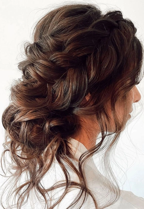 Wedding Hairstyles Image 13: Stunning brunette highlights and intricate styling Elegant brunette wedding hairstyle showcasing rich dimension and texture