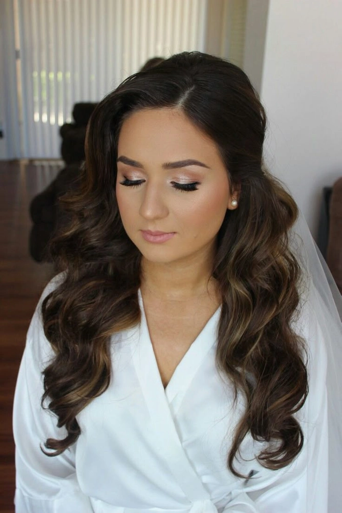 Brunette bride with dimensional hair styled for a wedding celebration Elegant wedding hairstyle showcasing brunette dimension with soft waves