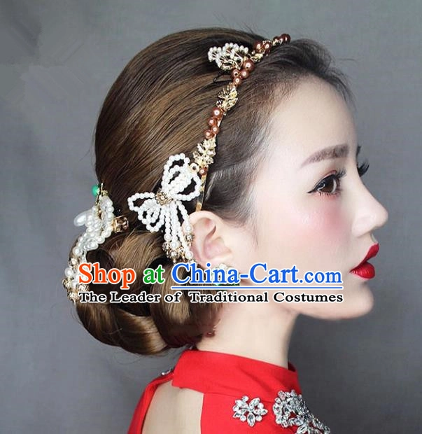 Elegant Chinese wedding hair styled with decorative hair sticks for a traditional bridal look