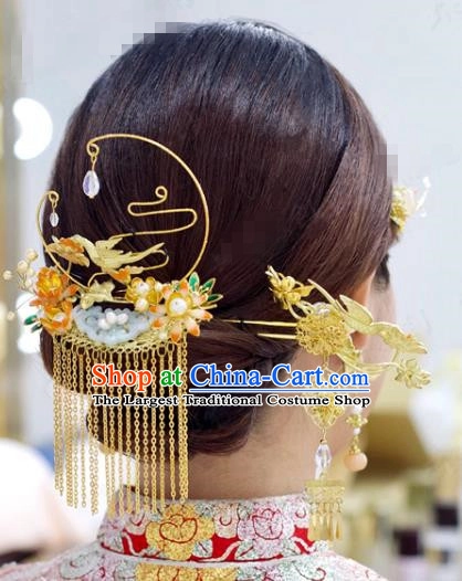 Elegant Chinese wedding hair styled with traditional hair sticks for a bridal look
