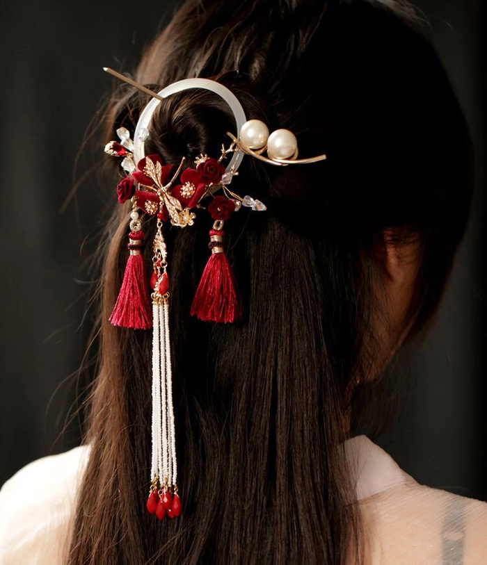Elegant Chinese wedding hairstyle adorned with delicate hair sticks
