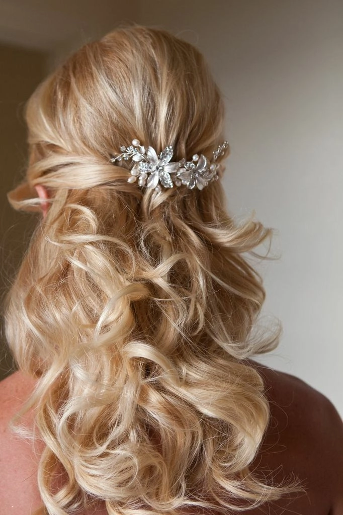 Elegant evening reception wedding hair changes with soft curls and accessories