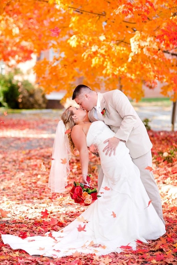 Elegant fall autumn wedding hair adorned with delicate leaves and soft curls