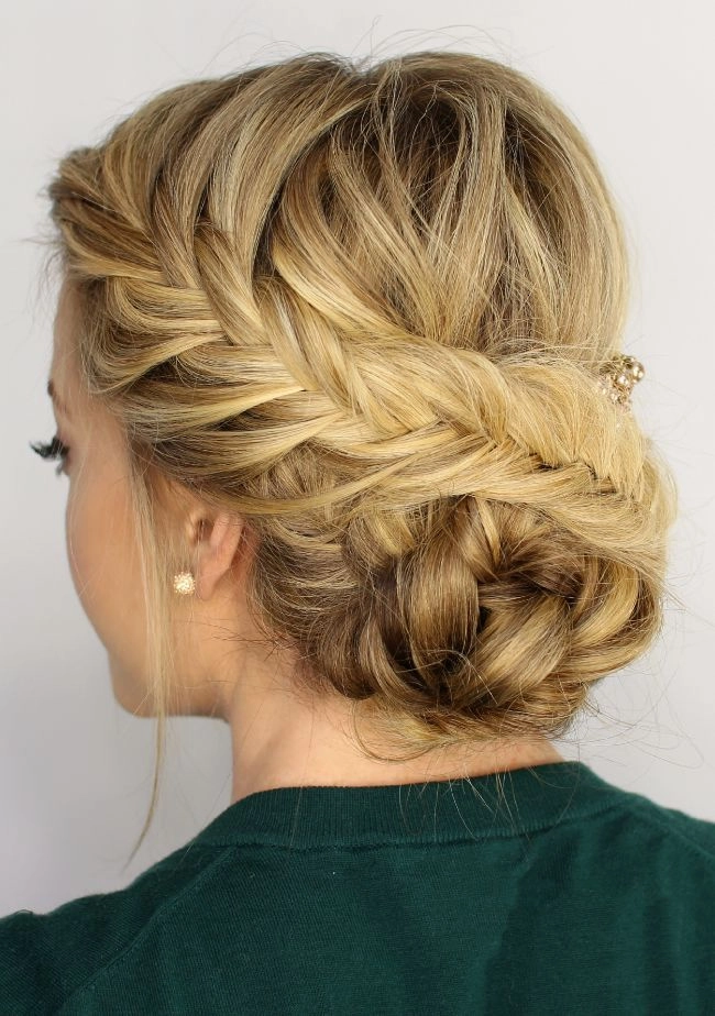 Beautiful fishtail braid updo perfect for brides and special wedding occasions Elegant wedding hair fishtail braid updo with soft curls and delicate accessories