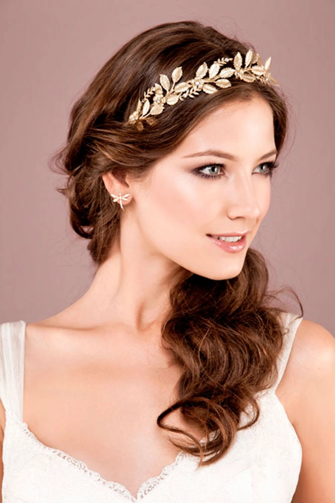 Elegant Greek wedding hair styled with a delicate olive wreath accessory