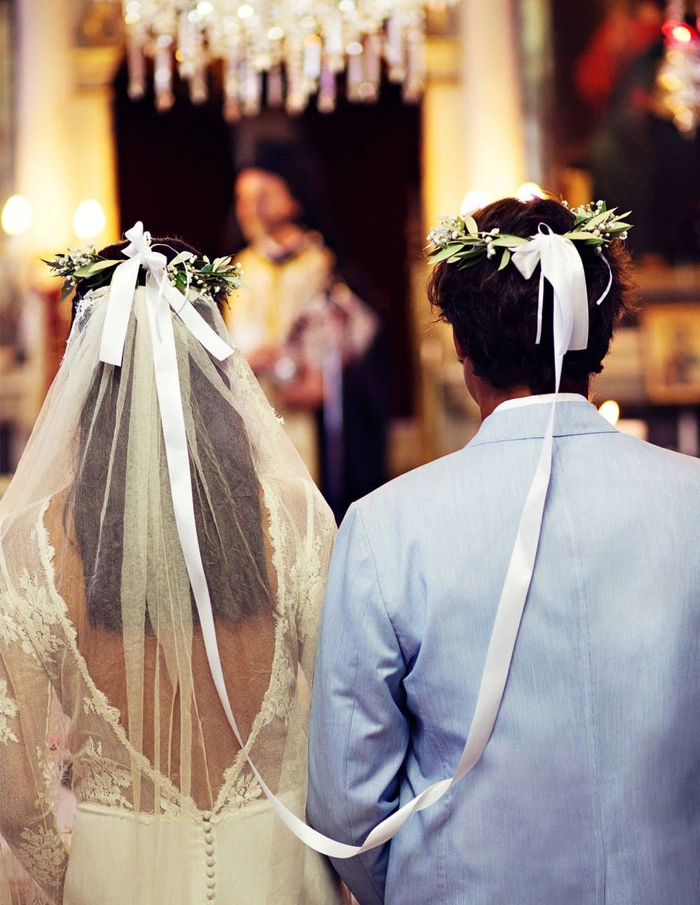 Elegant Greek wedding hair adorned with a delicate olive wreath for a classic bridal look