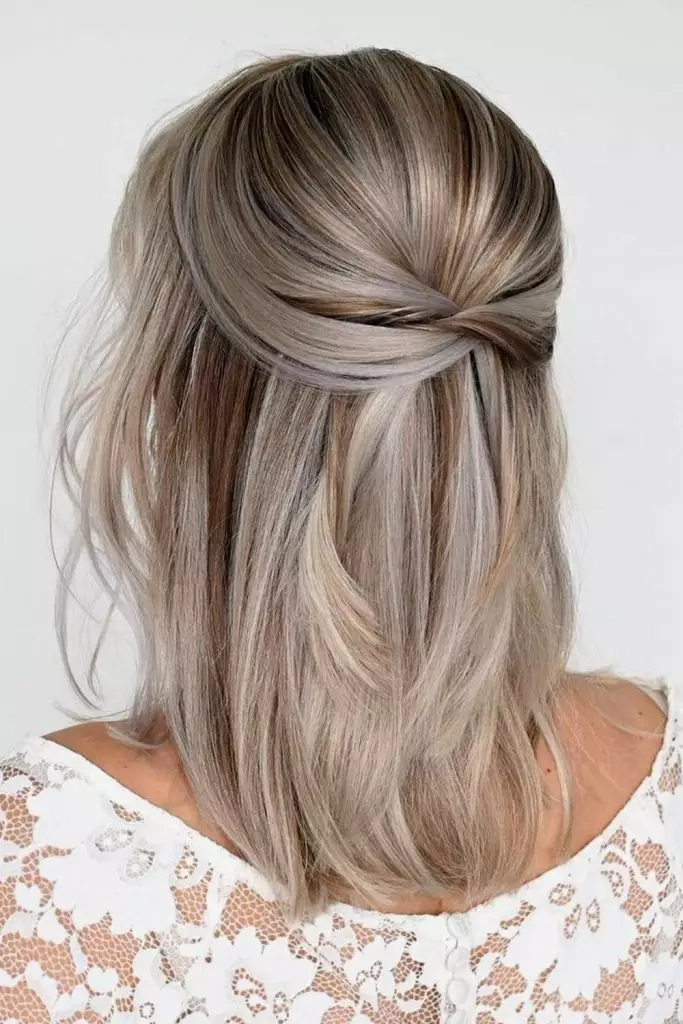 Elegant shoulder length wedding hair half up style with delicate curls