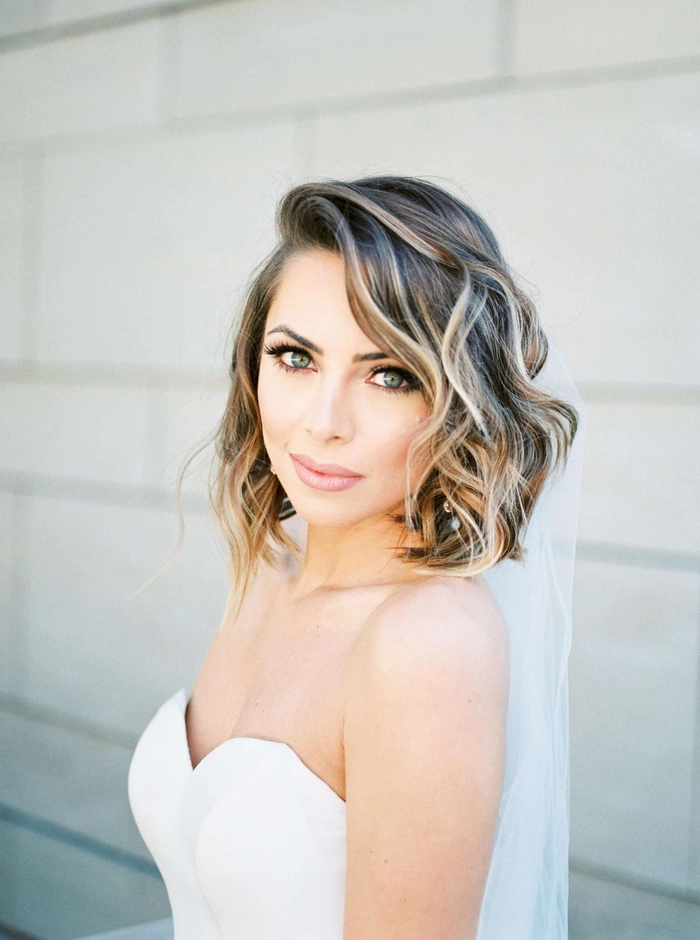 Elegant shoulder length wedding hair styled half up with soft curls