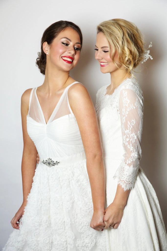 Elegant LGBTQ wedding hair style featuring soft curls and floral accessories