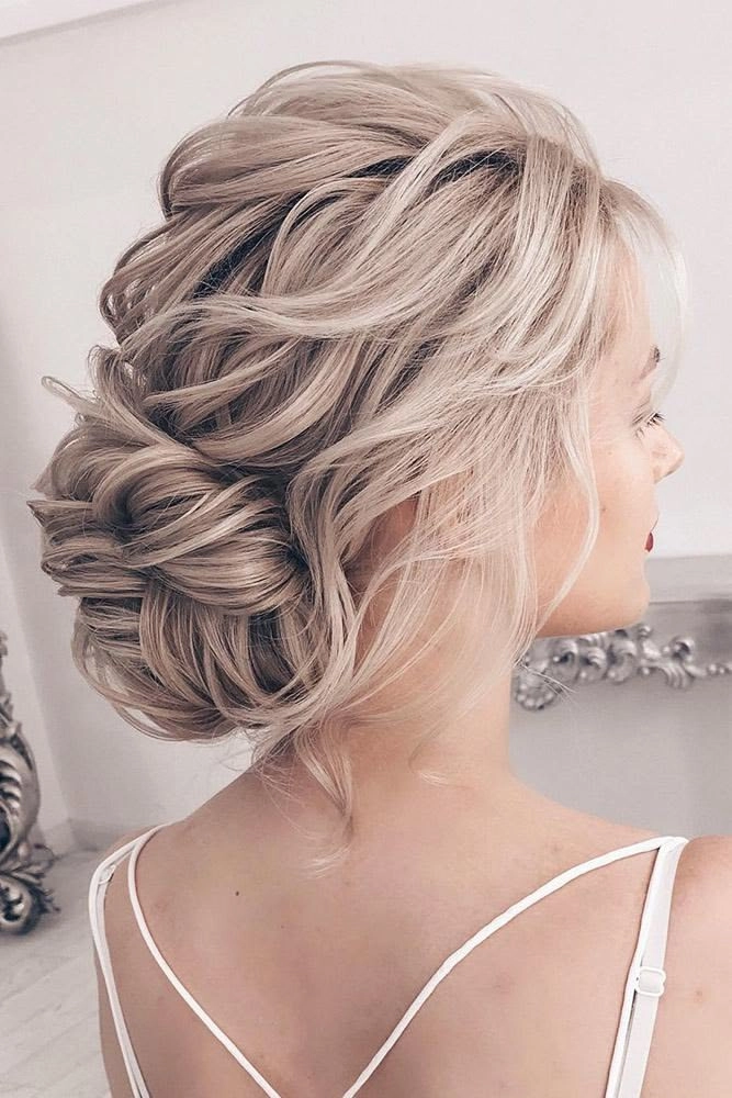 Sophisticated and graceful wedding hairstyle for the mother of the bride number 4 Elegant mother of the bride hairstyle featuring soft curls and delicate accessories