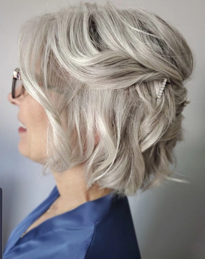 Elegant mother of the bride hair styled for thin hair with soft waves and volume