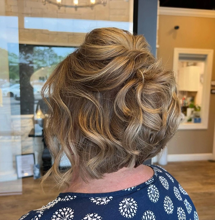 Elegant mother of the bride hair for thin hair styled in soft waves