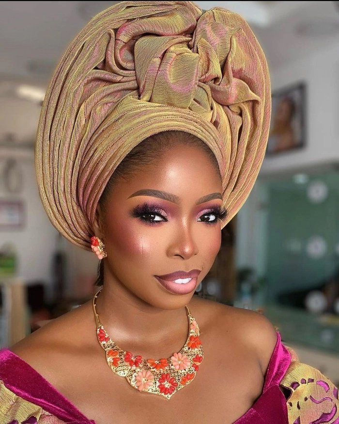 Elegant Nigerian bridal hair gele style with vibrant fabric and intricate pleats