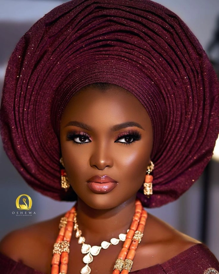Elegant Nigerian bridal hair gele style featuring vibrant fabric folds
