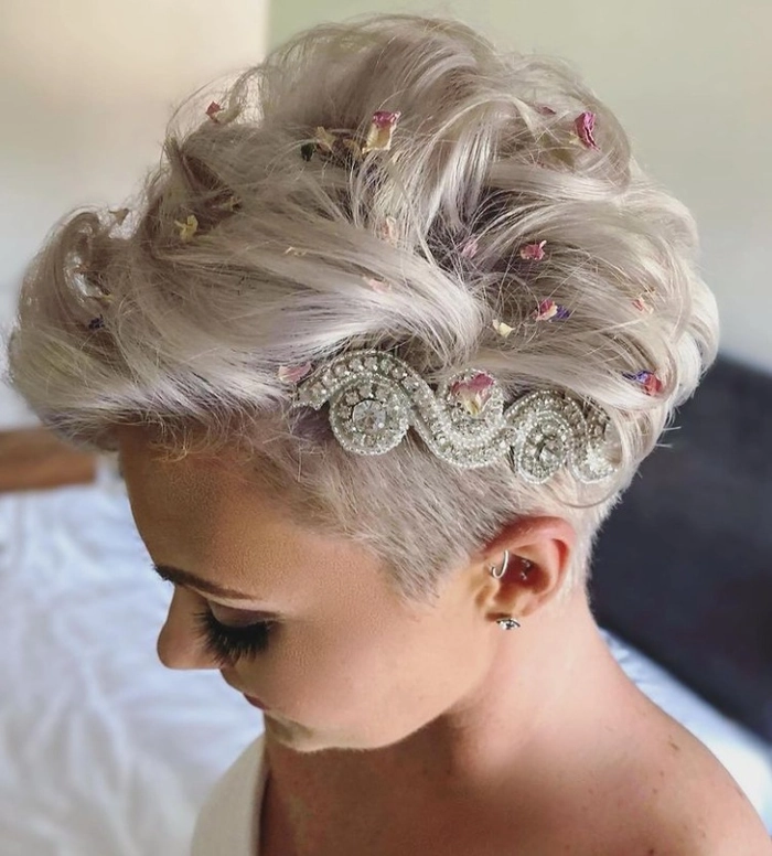 Pixie cut wedding hairstyle adorned with floral and pearl hairpieces for a special day Elegant pixie cut styled with delicate wedding hair accessories for a bridal look