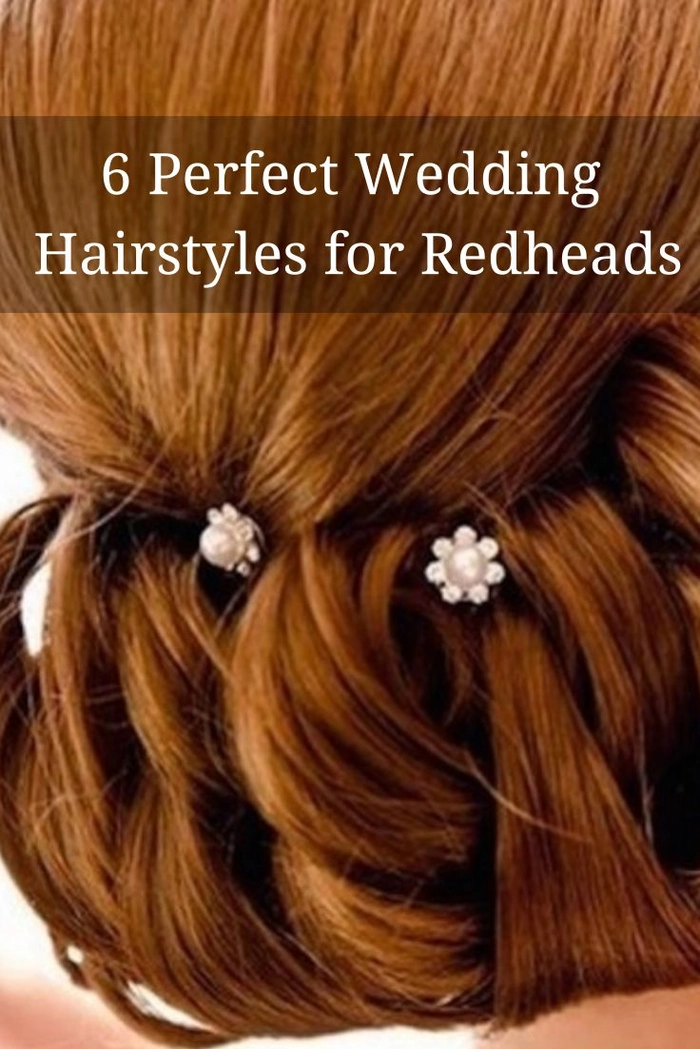 Elegant bridal hair for redheads styled in soft curls with floral accents