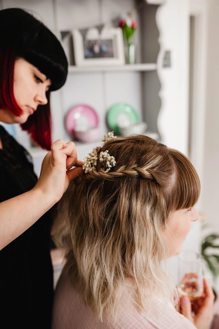 Short bob wedding hairstyles for brides showcasing a classic and chic bridal look Elegant short bob wedding hairstyle adorned with delicate floral accessories for brides