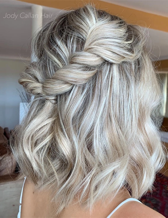 Short bob wedding hair inspiration for modern brides looking chic and simple Elegant short bob wedding hairstyle with floral accessories for brides