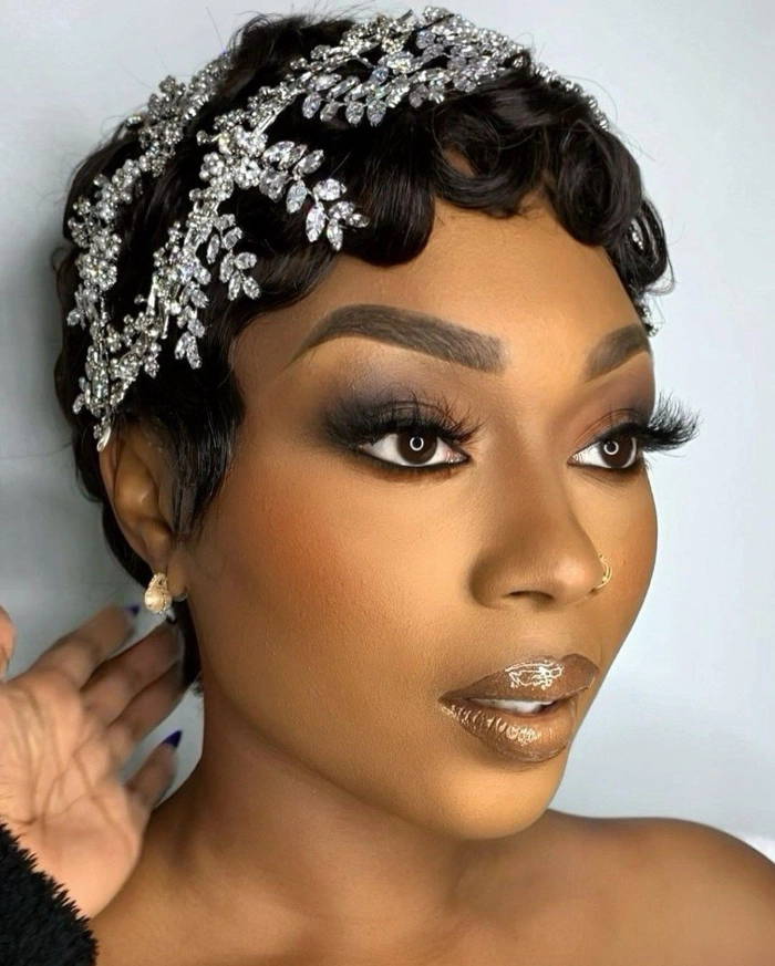 Short bob wedding hairstyles for brides featuring a classic and chic look Elegant short bob wedding hairstyle for a bride with delicate floral accessories