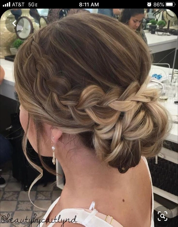 Stylish wedding hairstyle for short hair bridesmaids with a chic updo design Elegant short hair bridesmaid updo with soft curls and floral accessories