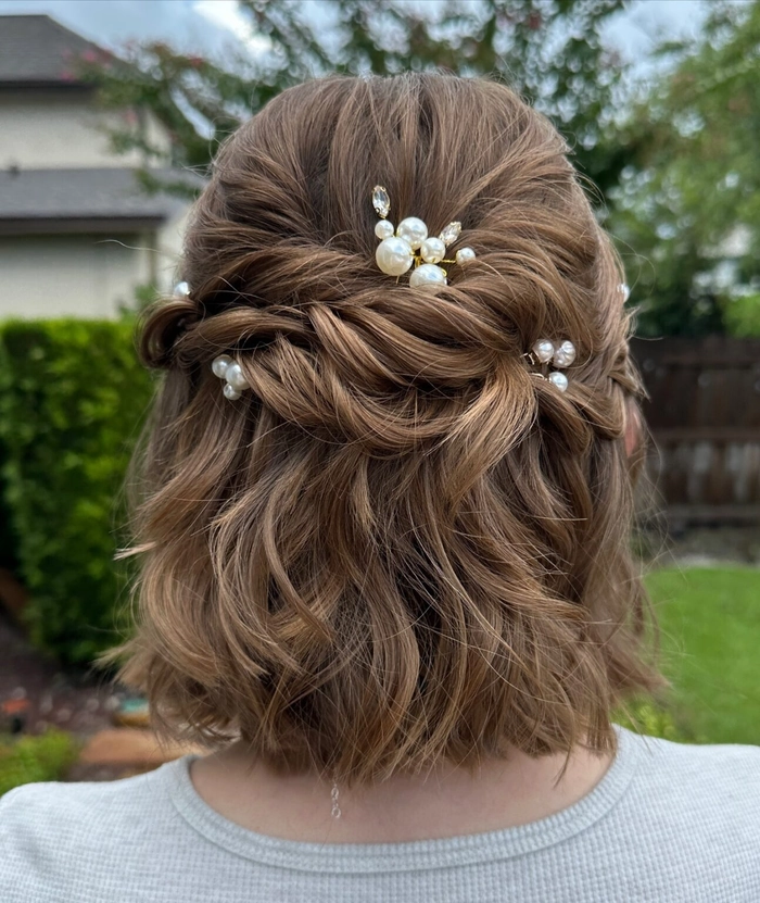 Chic and stylish short hair wedding look perfect for guests at any celebration Elegant wedding guest hairstyle for short hair with soft curls and floral accessories