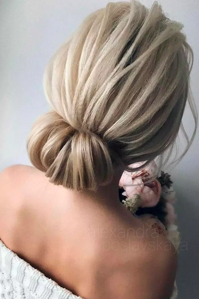 Short wedding hair with extensions perfect for a chic bridal look Elegant short wedding hair styled with extensions for added volume