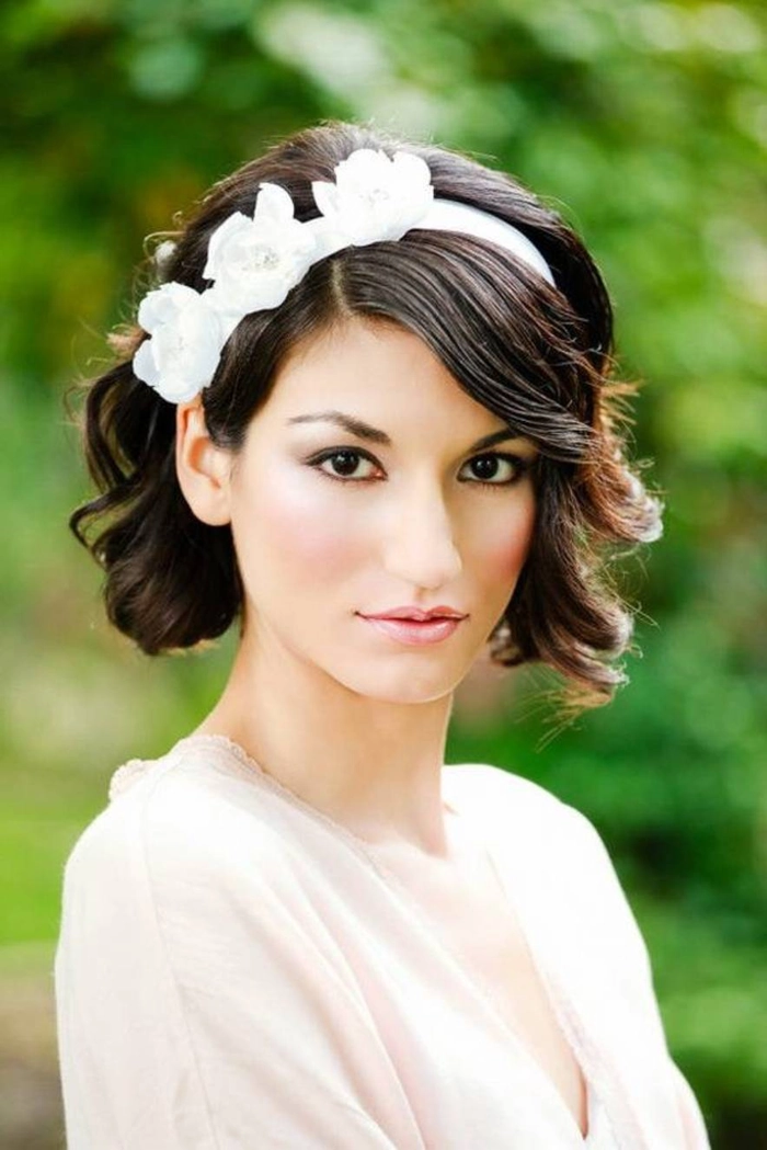 Elegant wedding hair for short layered hair with delicate floral accessories