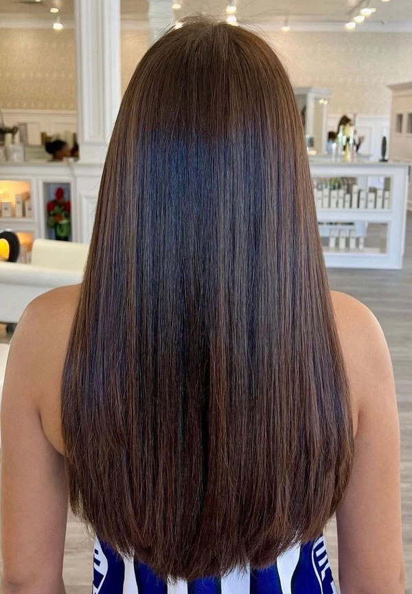 Elegant long straight sleek bridal hair with delicate accessories