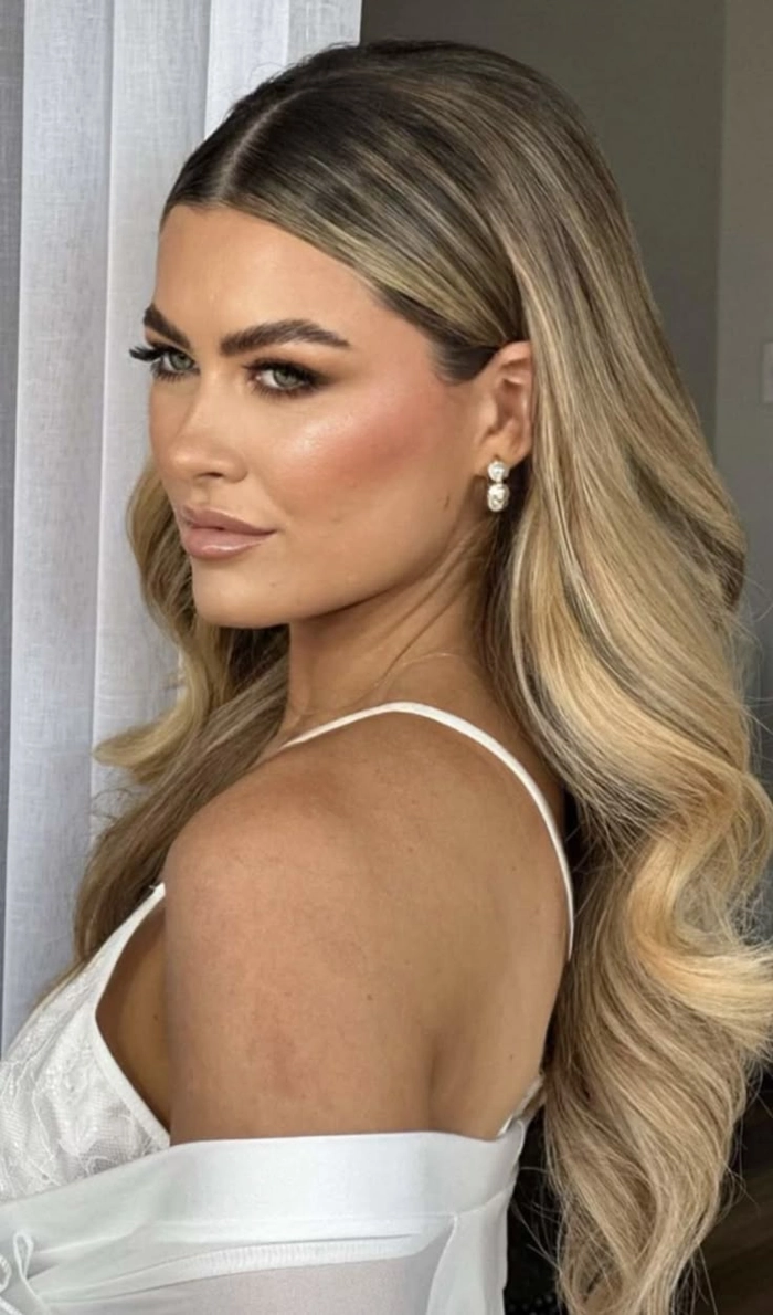 Elegant long straight sleek bridal hair styled for a wedding day