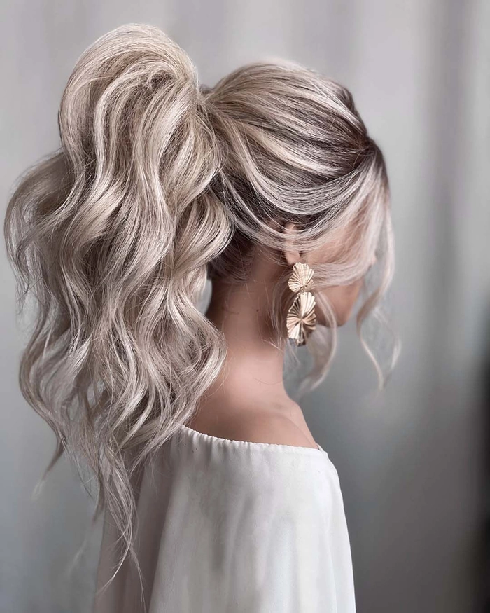 Chic and polished sleek high ponytail wedding hairstyle inspiration Elegant sleek high ponytail wedding hair styled for a modern bride