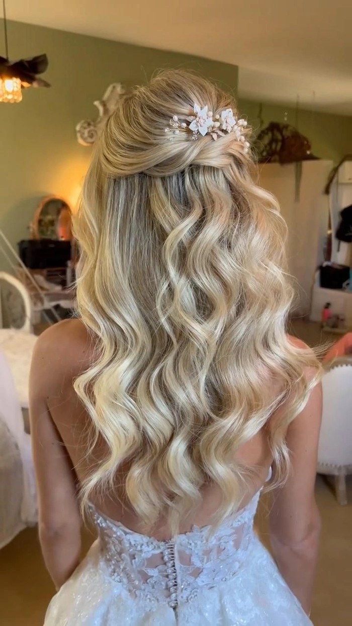 Elegant updo bridesmaid hairstyle for long hair with soft curls